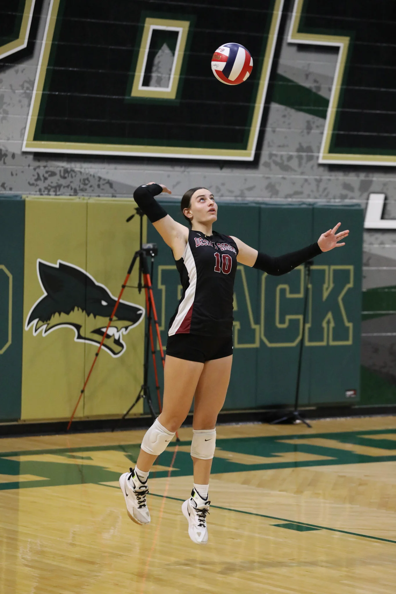 DRHS player about to serve the ball